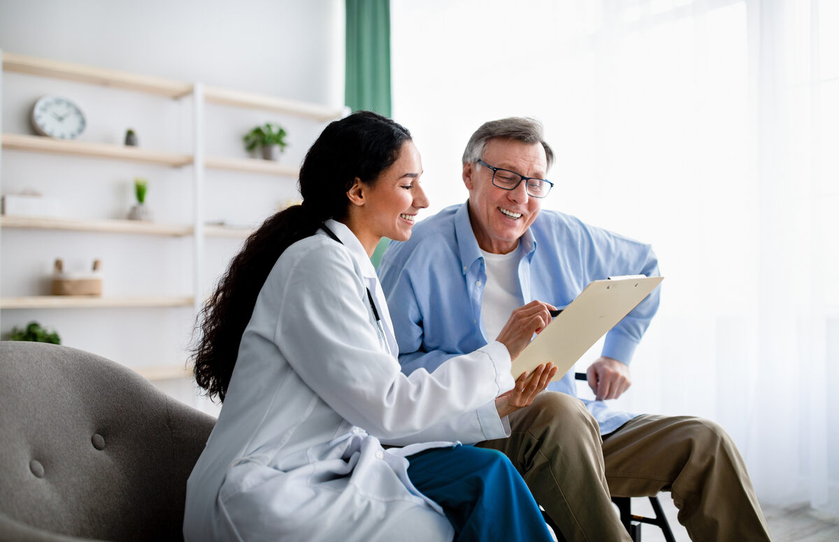 doctor asking senior patient health questions